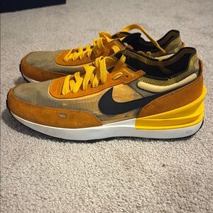 Nike Orange and Black Sneakers with Classic Low-Top Design
